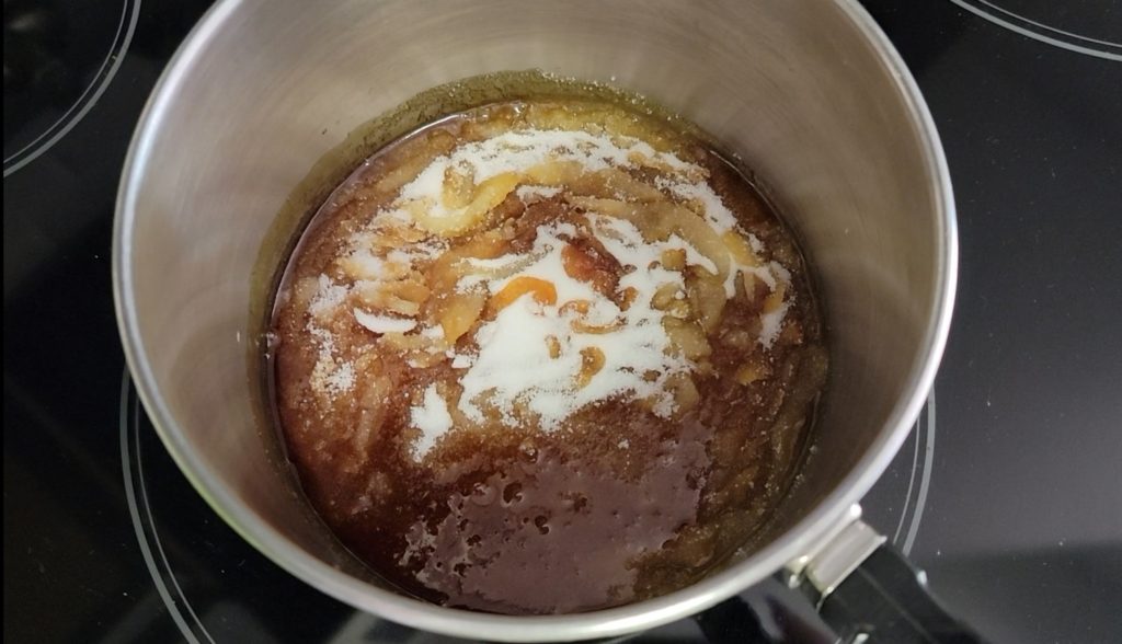 melt sugar until an amber color to create caramel for Puerto Rican Flan de Queso